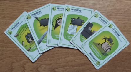 Zu sehen sind die Entschärfungskarten von Explodding Kittens.